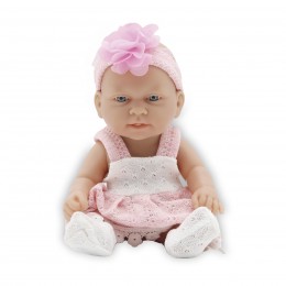 26-CM DOLL IN A PINK DRESS...